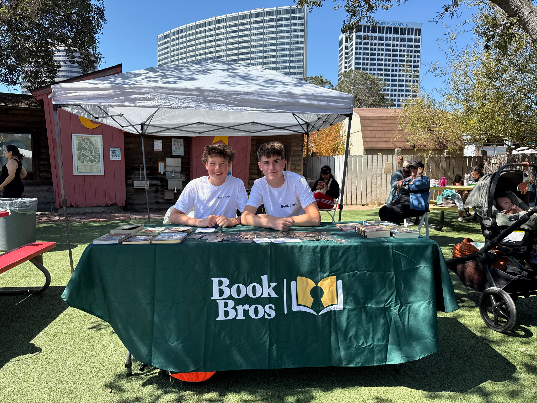 Two Book Bros members at their book table at the Children’s Fairyland Book Festival.